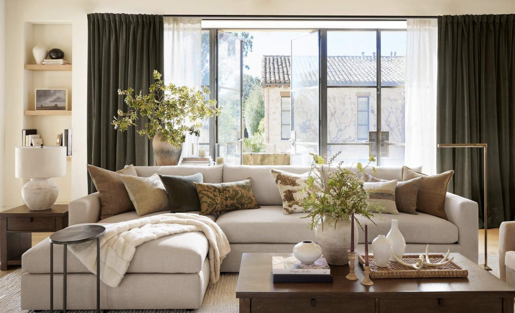 Olive green velvet curtains with sheer white drapes framing large windows in a modern living room Olive green velvet curtains with sheer white drapes framing large windows in a modern living room