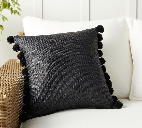gray pom pom pillow