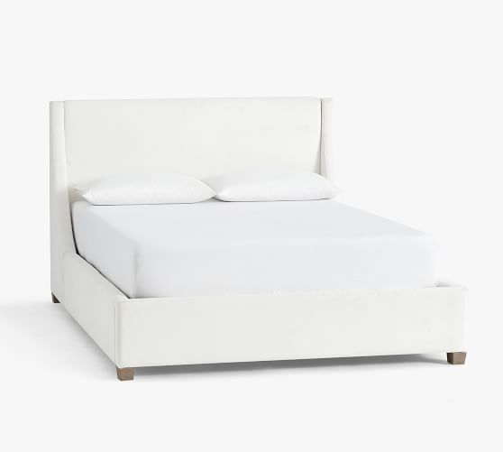 white upholstered king bed