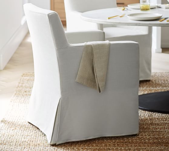 white slipcovered dining armchair