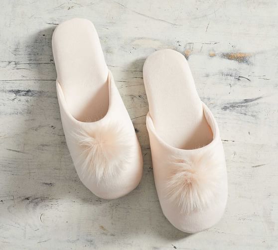 white slippers with pom poms