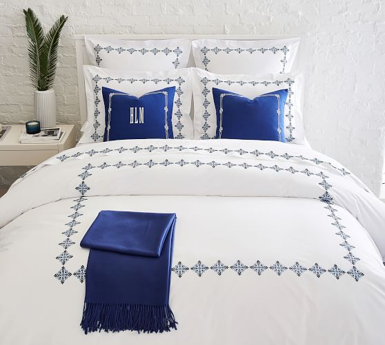 white duvet cover with blue embroidery