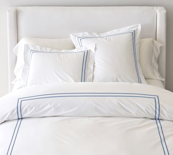 white duvet cover with navy blue trim