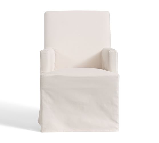 white slipcovered dining armchair