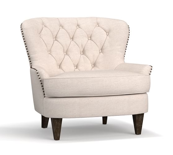 tufted armchair with nailheads