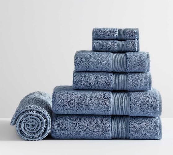 blue bath mat and towels