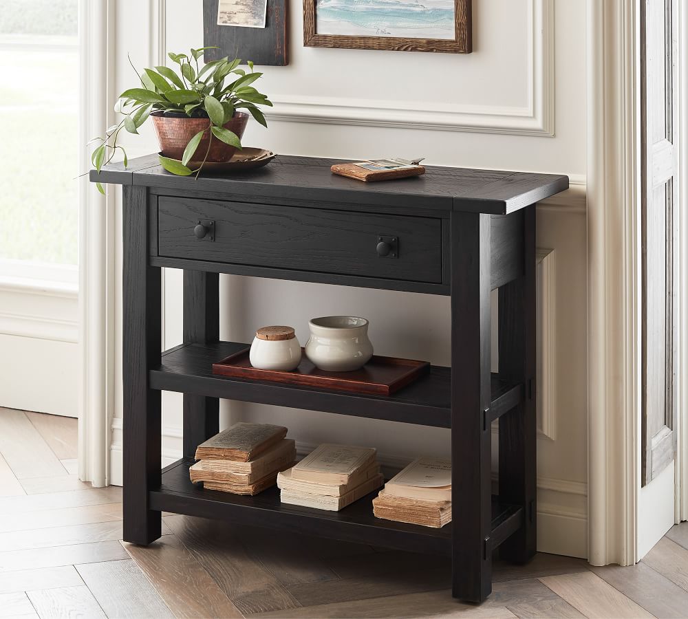 narrow black console table with drawers