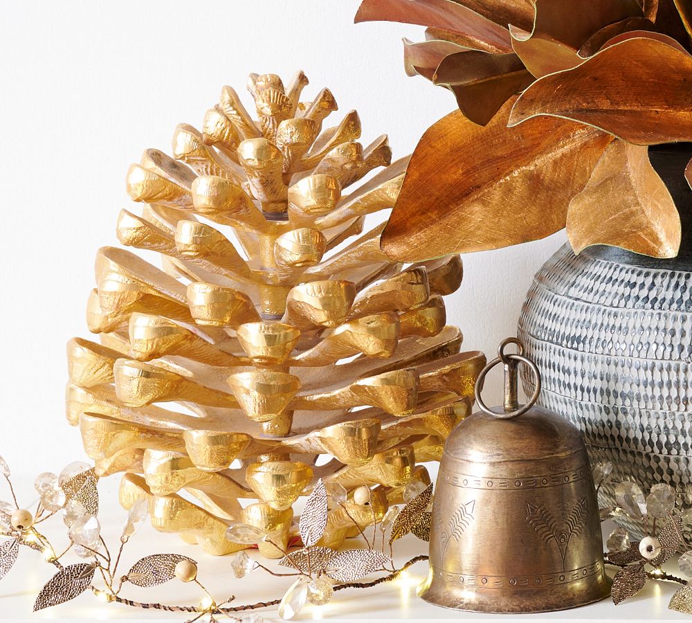 103, Christmas bells on a fir tree branch with pinecones