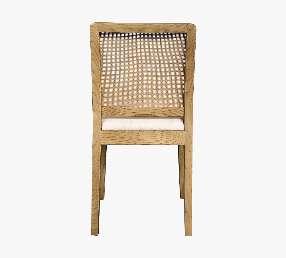 Axl Upholstered Cane Dining Chair Pottery Barn