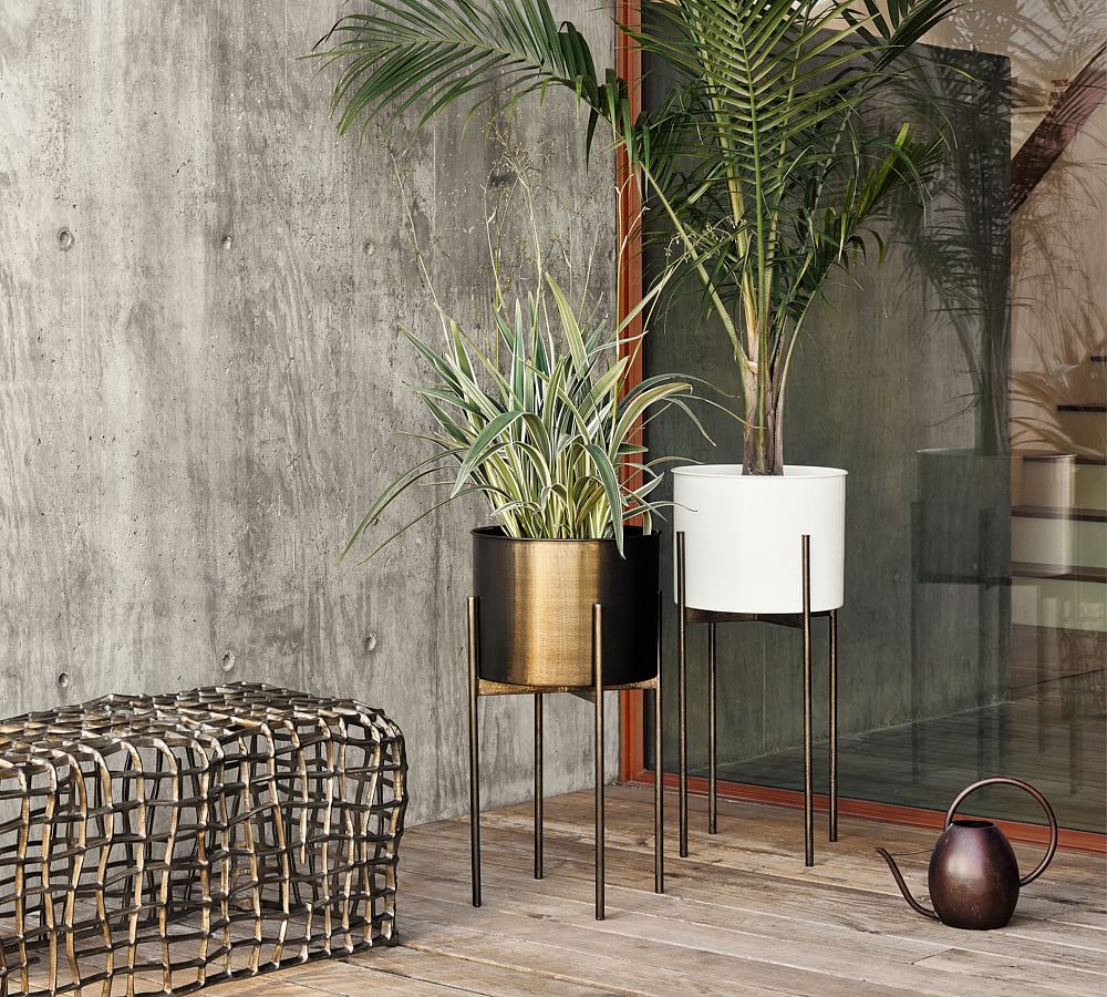 https://assets.pbimgs.com/pbimgs/ab/images/dp/wcm/202329/0383/open-box-isa-26-modern-planter-with-stand-weathered-brass-l.jpg