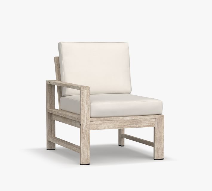 Single armchair with light wood frame and cream cushion