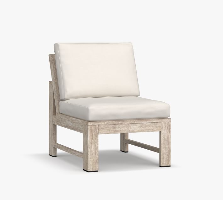 Close-up of a single outdoor chair with cream cushion