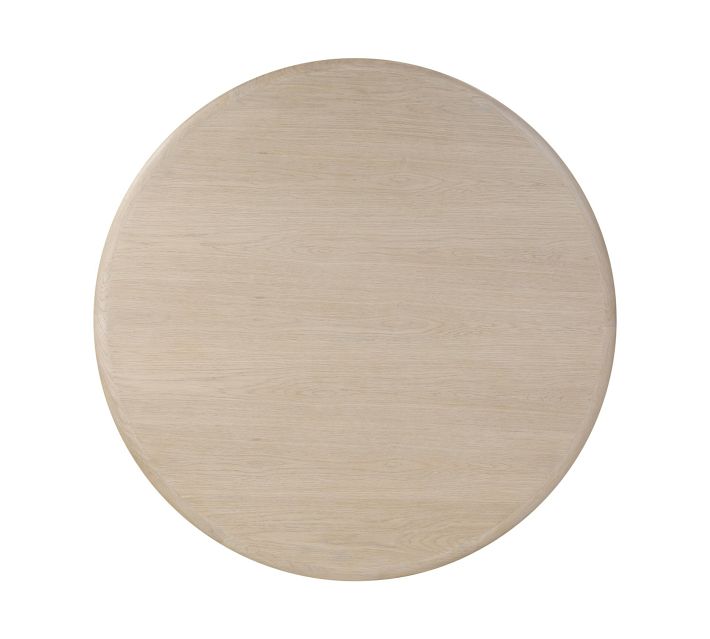 Circular light wood tabletop close-up showing grain