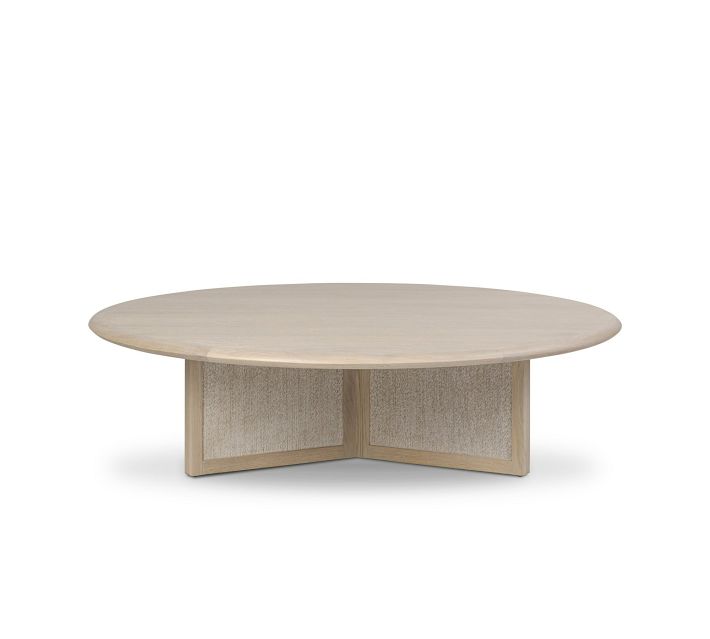 Small light wood round coffee table with fabric panels