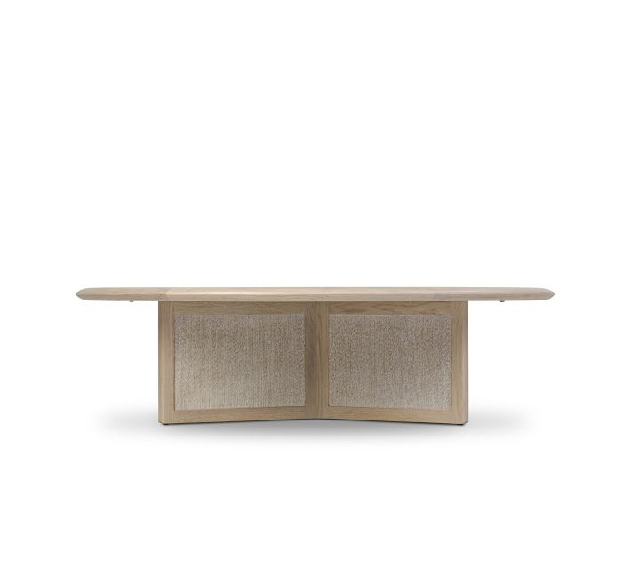 Round light wood coffee table with fabric panels and glass bowl