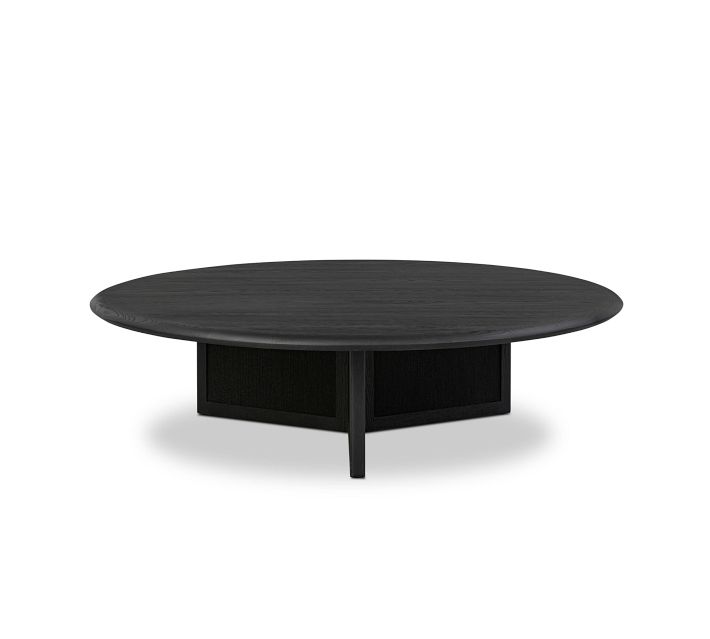 Round black coffee table with pedestal base