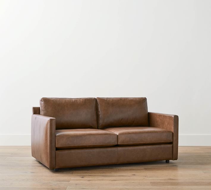 Brown leather sofa from side/back view