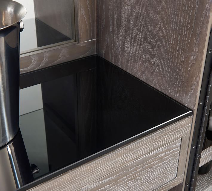 Close-up of a dark wooden countertop corner with a glossy black surface.