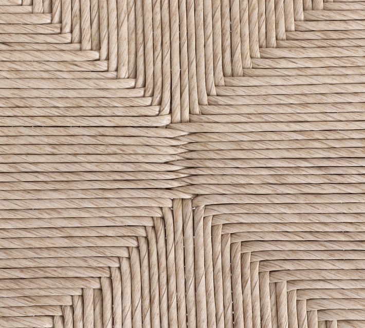 Patterned weave detail on the top of a woven seat creating a star-like design.