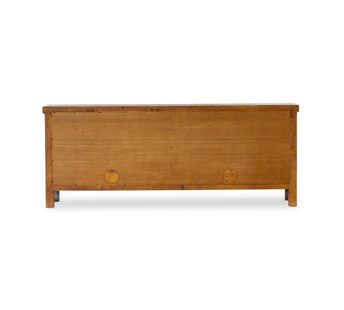 Back view of a plain wooden chest/dresser with low height and simple construction.