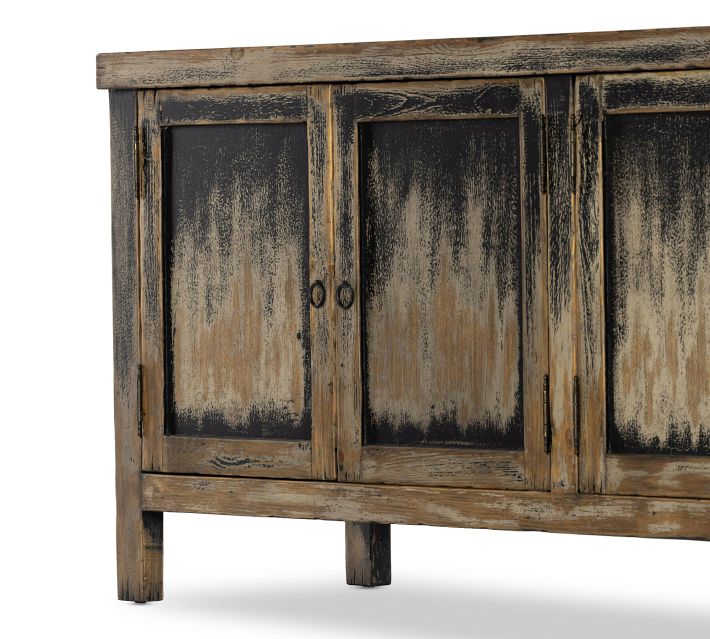 Full view of the rustic credenza with four cabinet doors and distressed finish.