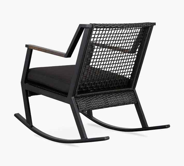 Back view of a single outdoor rocking chair with woven back and cushion