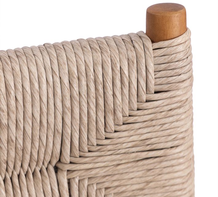 Close-up of beige braided rope used for weaving on furniture, showing thickness and texture.