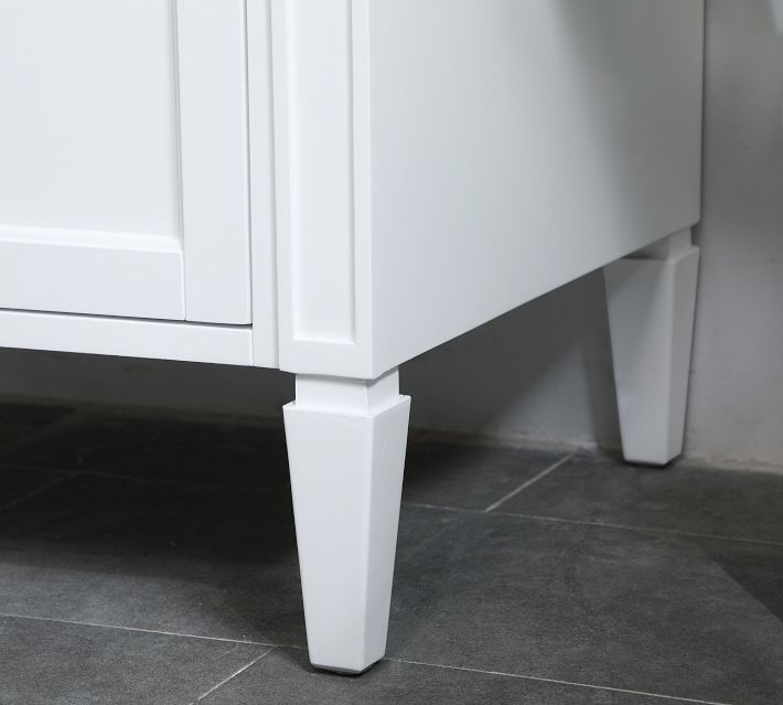 Close-up of the faucet base and leg of vanity