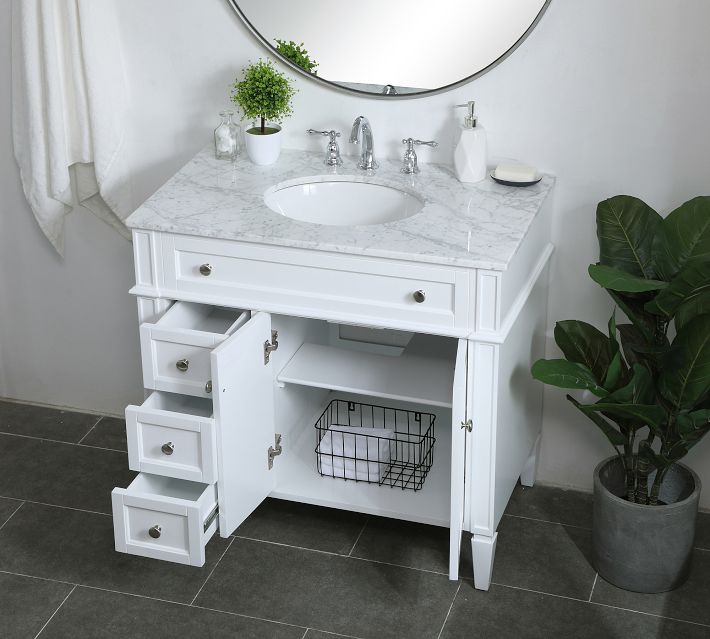 Close-up of marble countertop with sink edge and soap dispenser