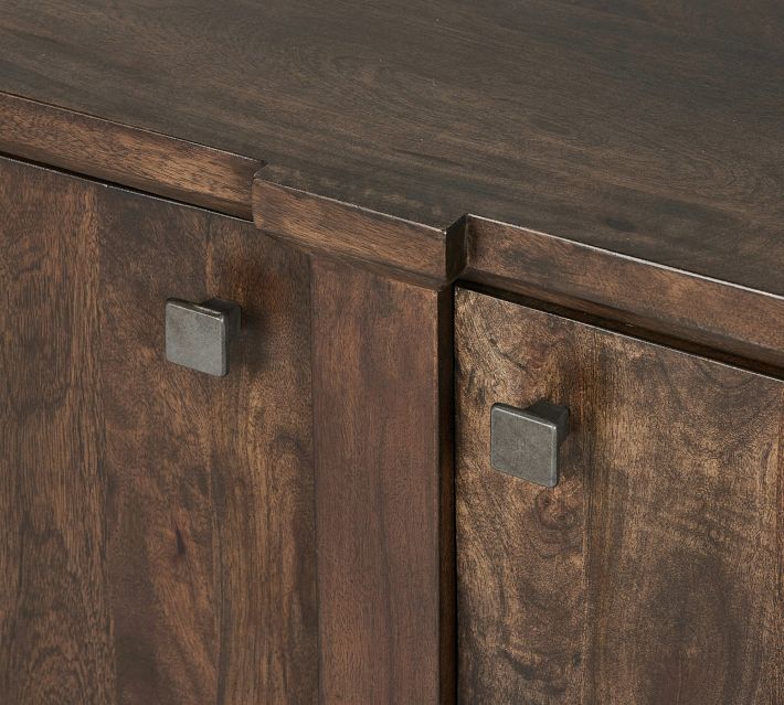 Close-up of metal square drawer pulls and wood veneer