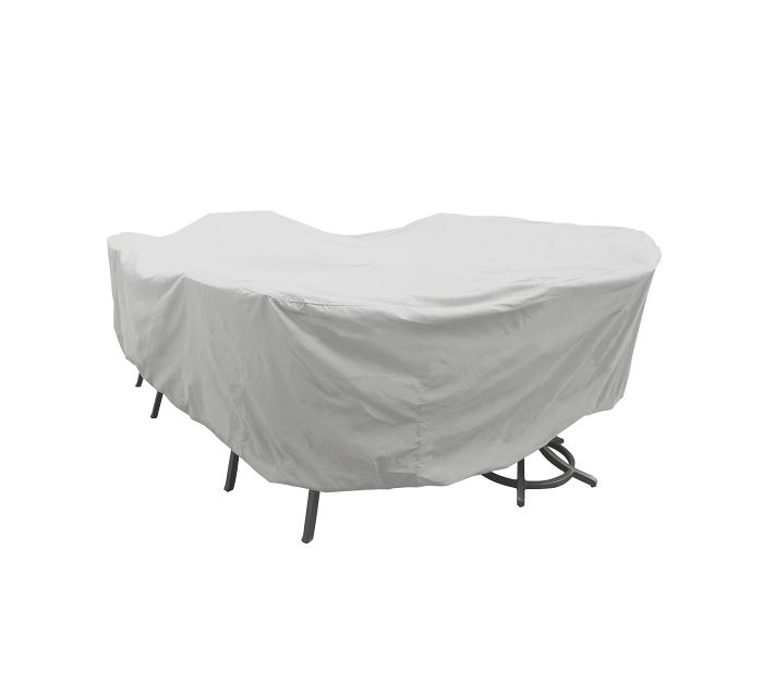 Outdoor furniture piece covered with a light gray protective cover; curved front edges