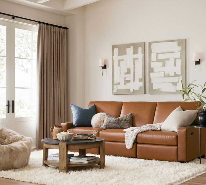 Living room with leather sofa and decorative pillows
