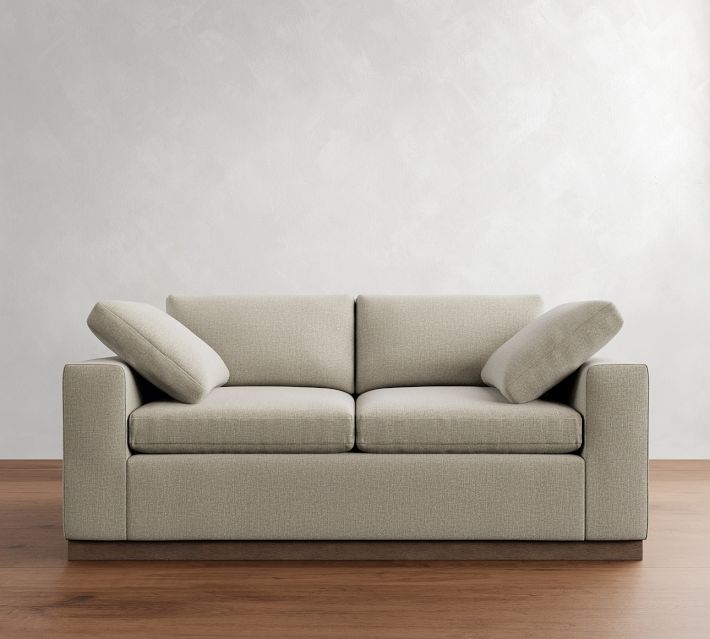  front view of beige sofa highlighting two seat cushions and two back cushions