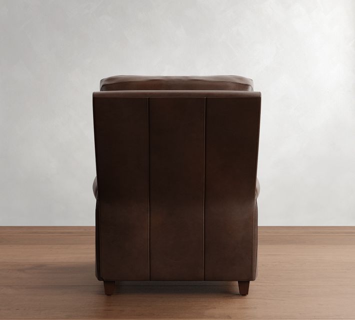 Rear view of a brown leather ottoman-style chair stacked with three vertical panels