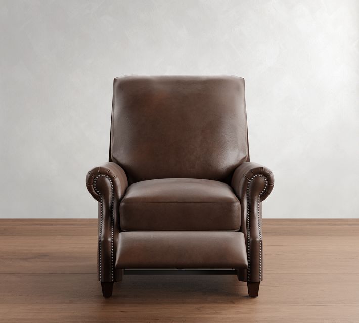 Front view of a brown leather armchair with nailhead trim and rounded arms