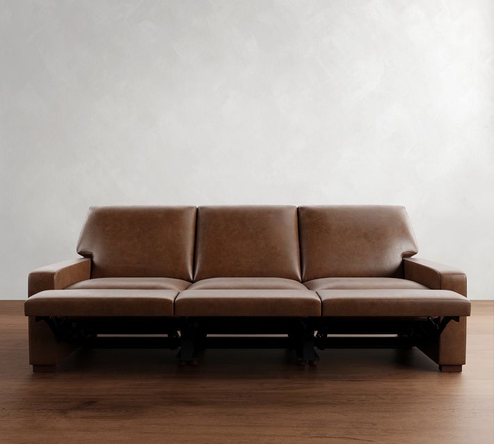 Front view of brown leather sofa with three cushions