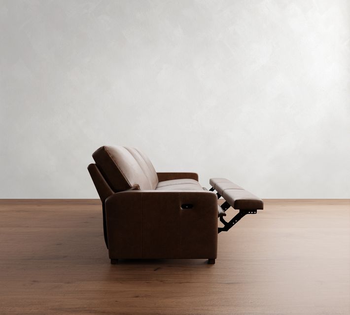 Side of brown leather sofa with built-in recline mechanism