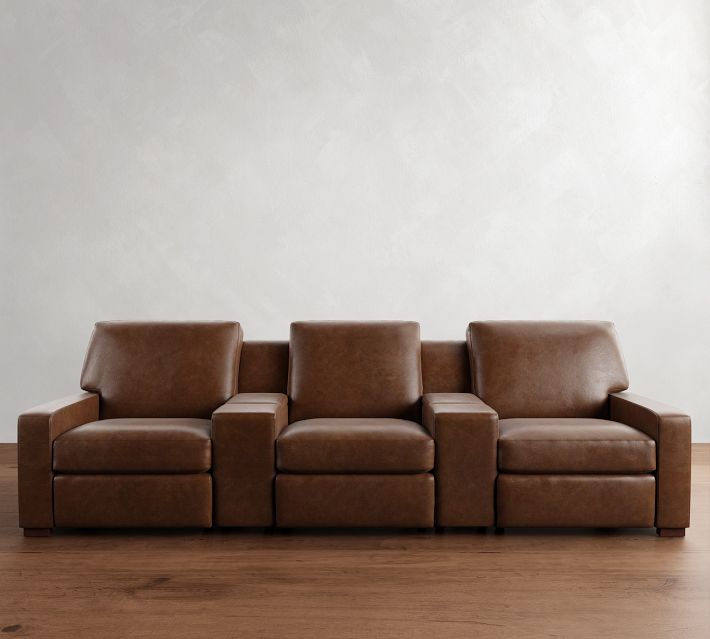 Wide view of three-seat leather sofa set in a row