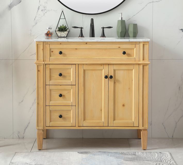 Natural wood vanity with marble top, multiple drawers and cabinet doors