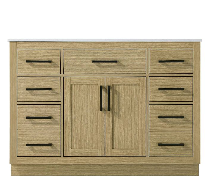 Two-tone wooden vanity with multiple drawers and center cabinets.