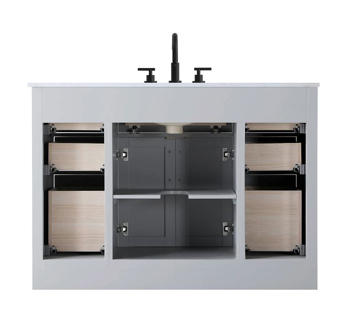 Under-sink view showing cabinet storage and plumbing access.