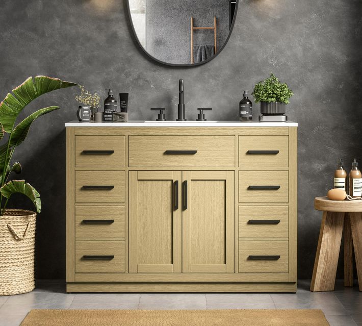Wooden bathroom vanity with multiple drawers and central cabinets in a living scene.