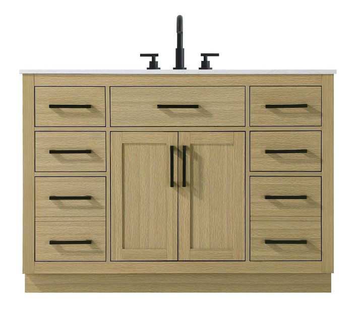 Wooden bathroom vanity with top-mounted faucet and three drawers on either side.