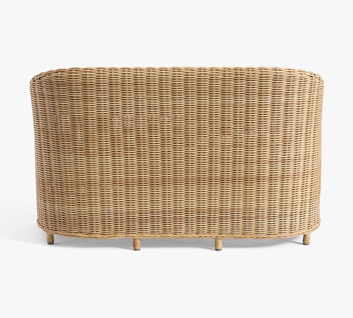 Back view of brown wicker sofa showing curved woven pattern and feet