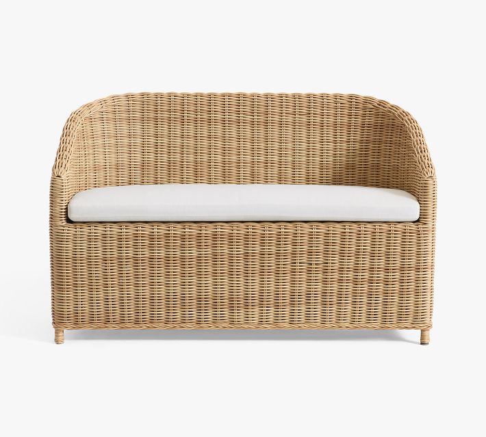 Wicker loveseat with white cushion on plain white background, product studio image