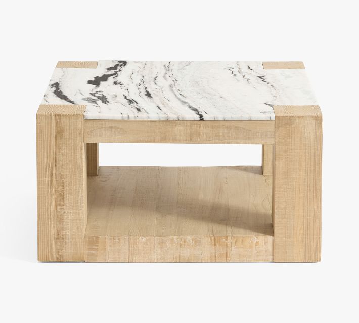 Square wooden coffee table with marble top and open storage shelf beneath.