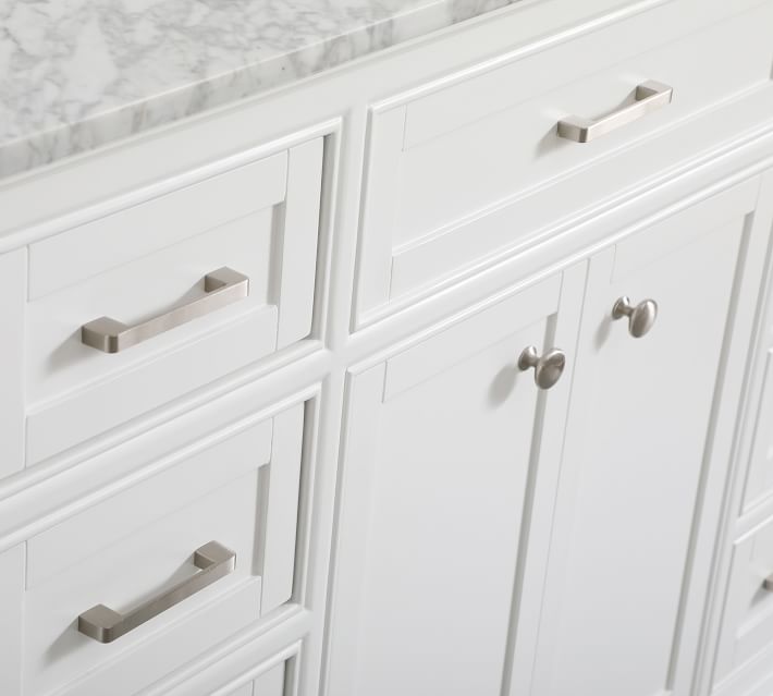 Close-up of lower drawers and cabinet face on white vanity