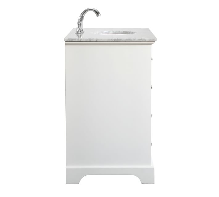 Side view of single vanity with marble countertop and faucet