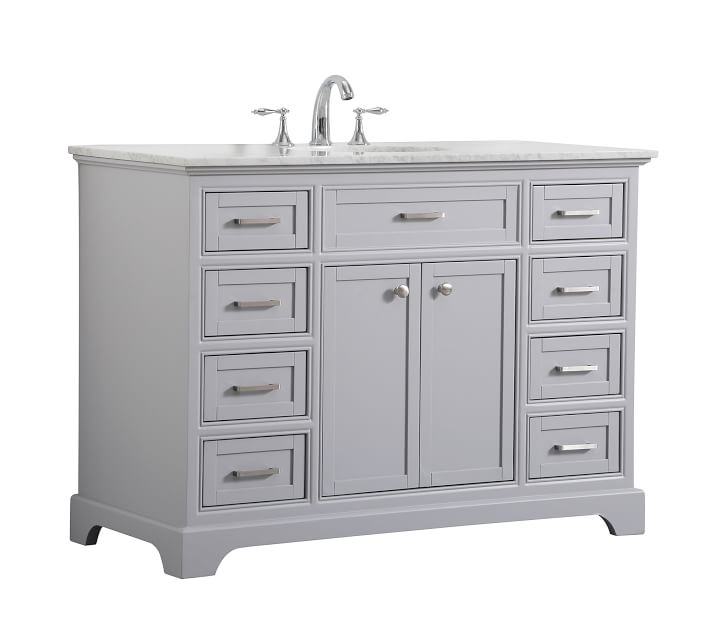 Right-side view of bathroom vanity with marble top and minimalist hardware