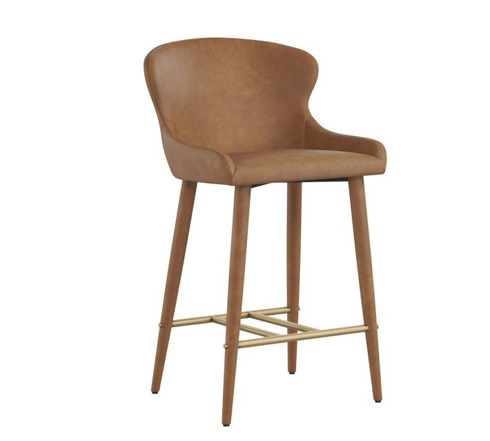 Bar chair with caramel brown leather upholstery and tapered wooden legs, includes gold-toned metal footrest supports.